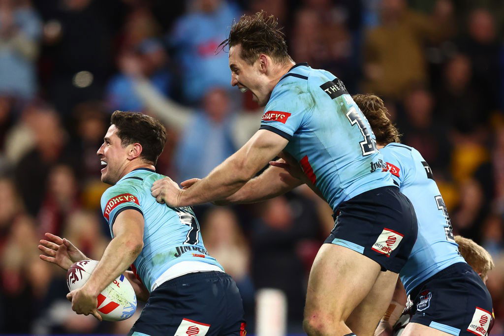 Cameron Murray jumps on the back of Mitchell Moses in State of Origin III.