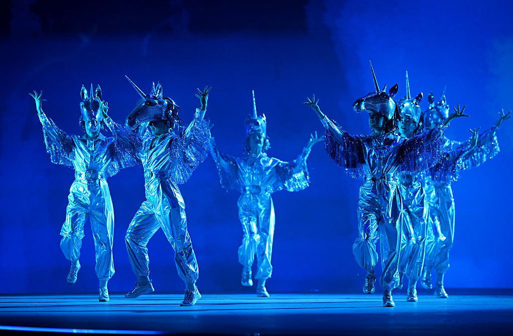 Performers in Unicorn costumes dance on stage during the Opening Ceremony of the Glasgow Commonwealth Games.