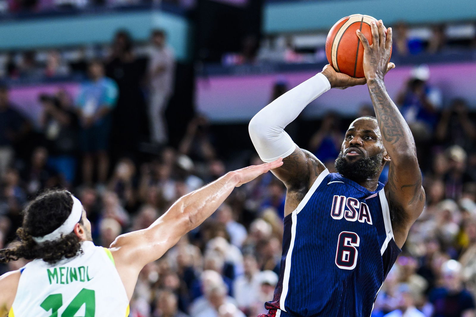 LeBron James in a shooting action over a Brazil defender.