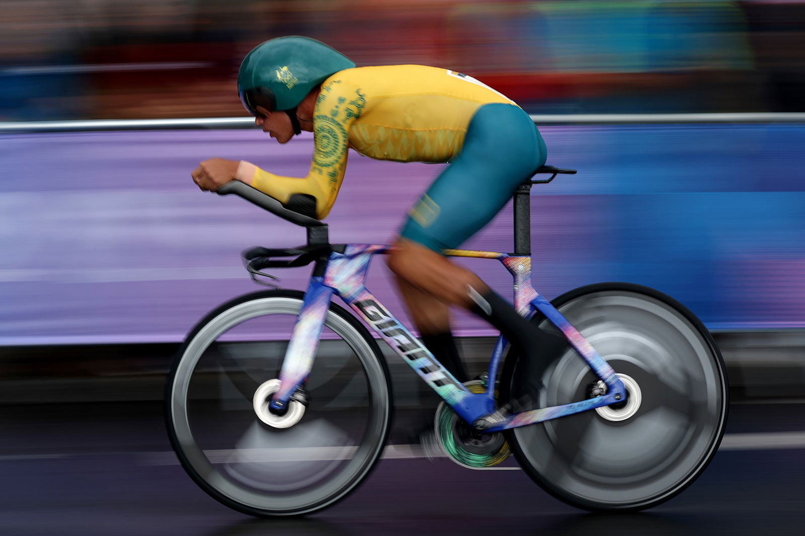 A road cyclist wearing an Australian uniform competing.