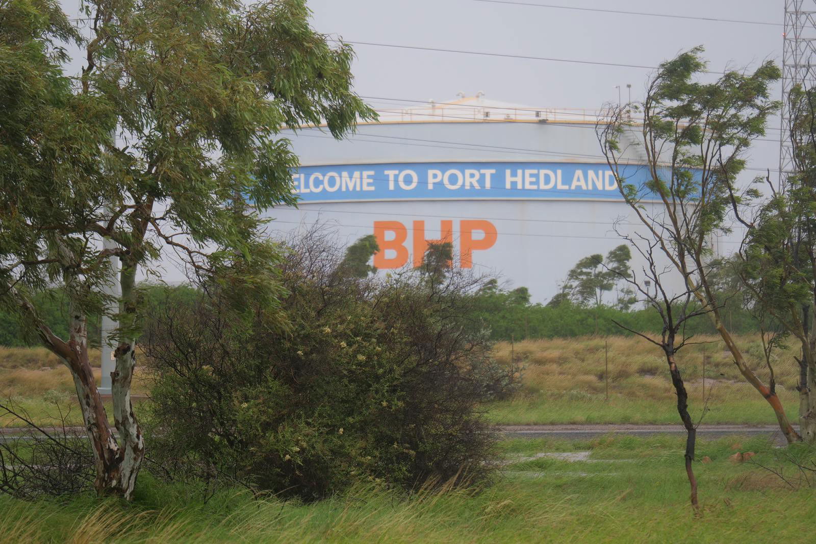 A silo with BHP welcome to Port Hedland written on the side