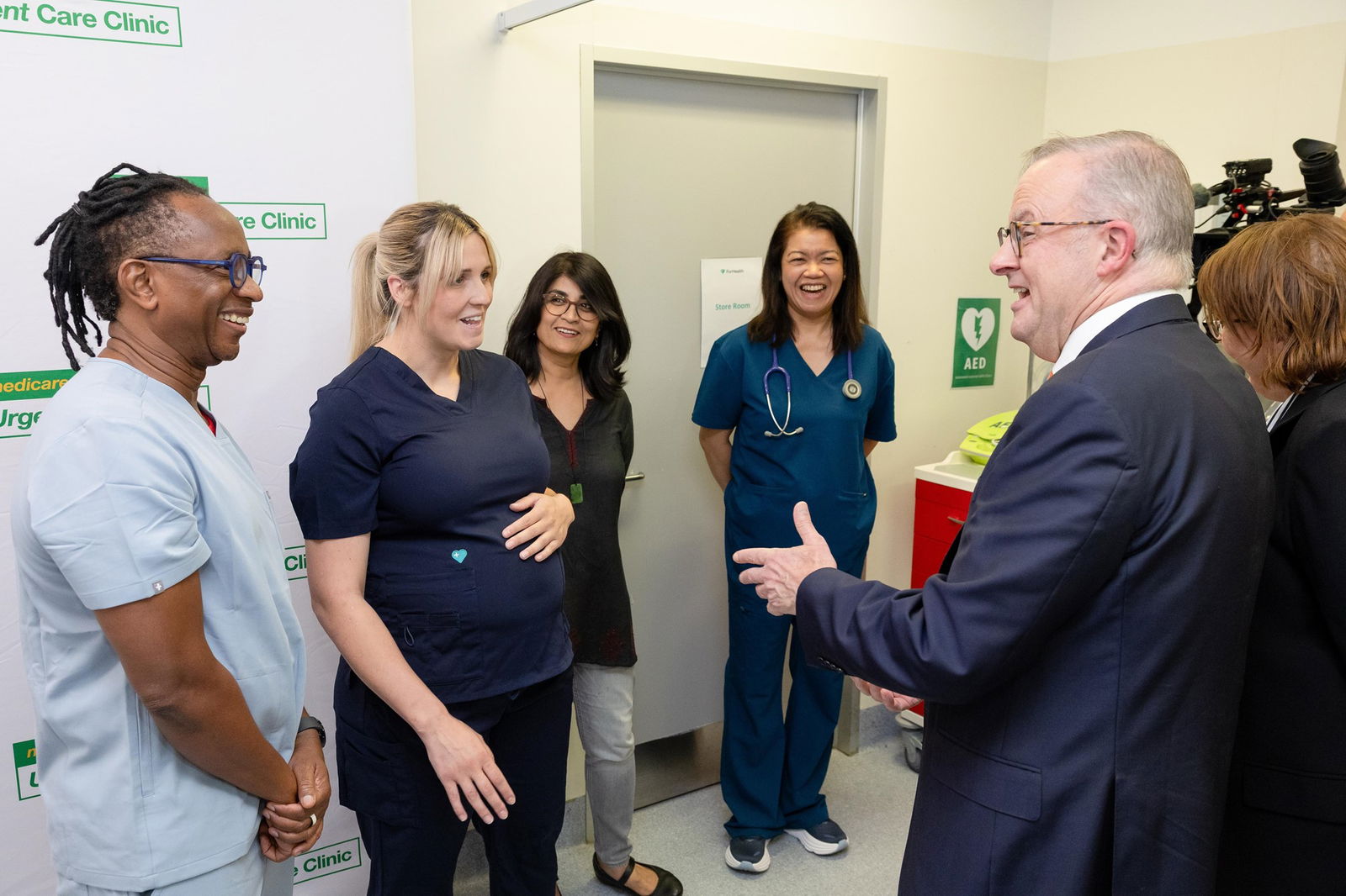 Anthony Albanese stands with several medical professionals.