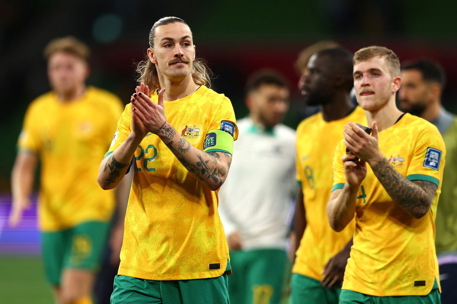 Jackson Irvine applauds the crowd