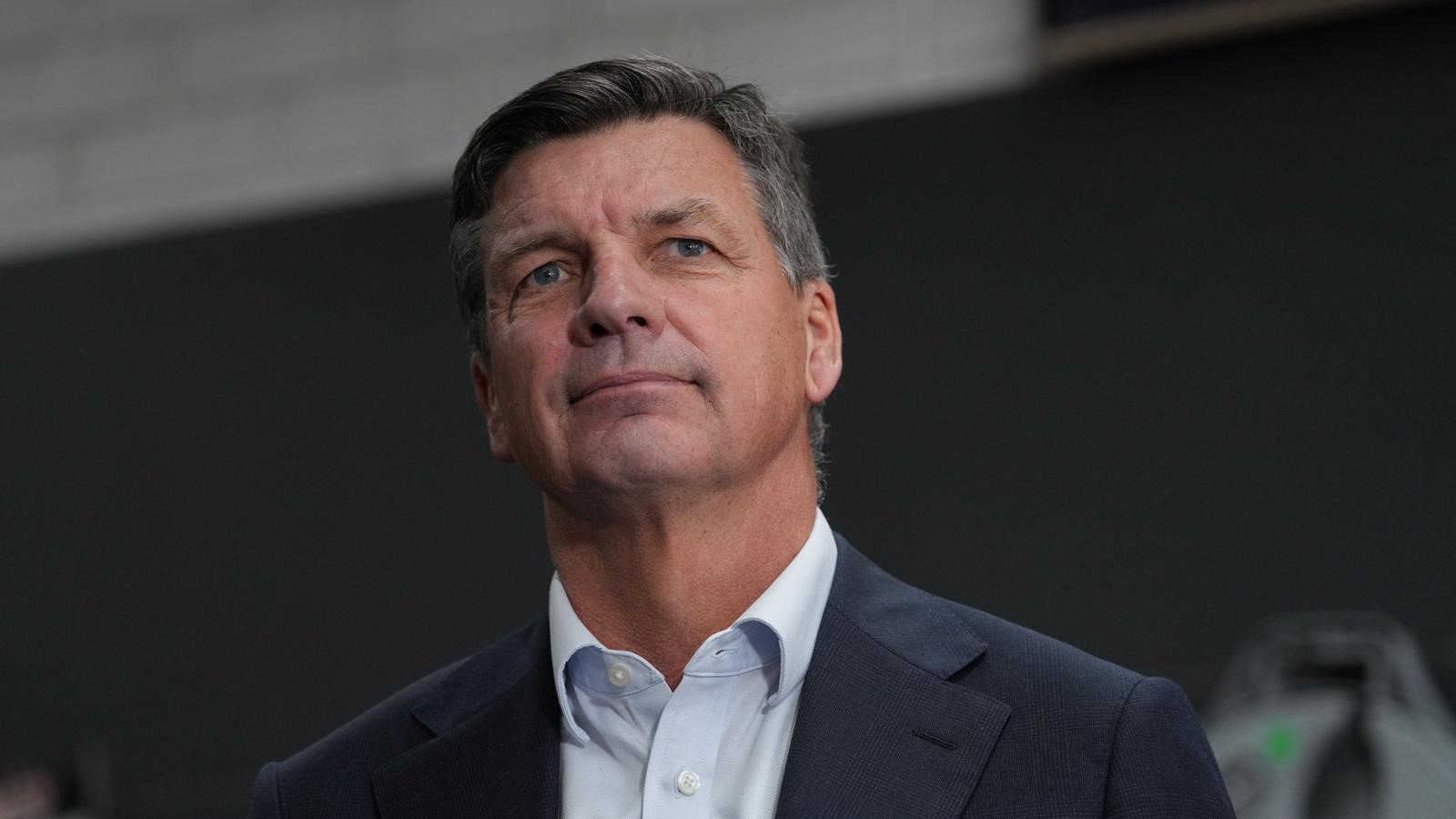 Angus Taylor looking off into the distance at a press conference.
