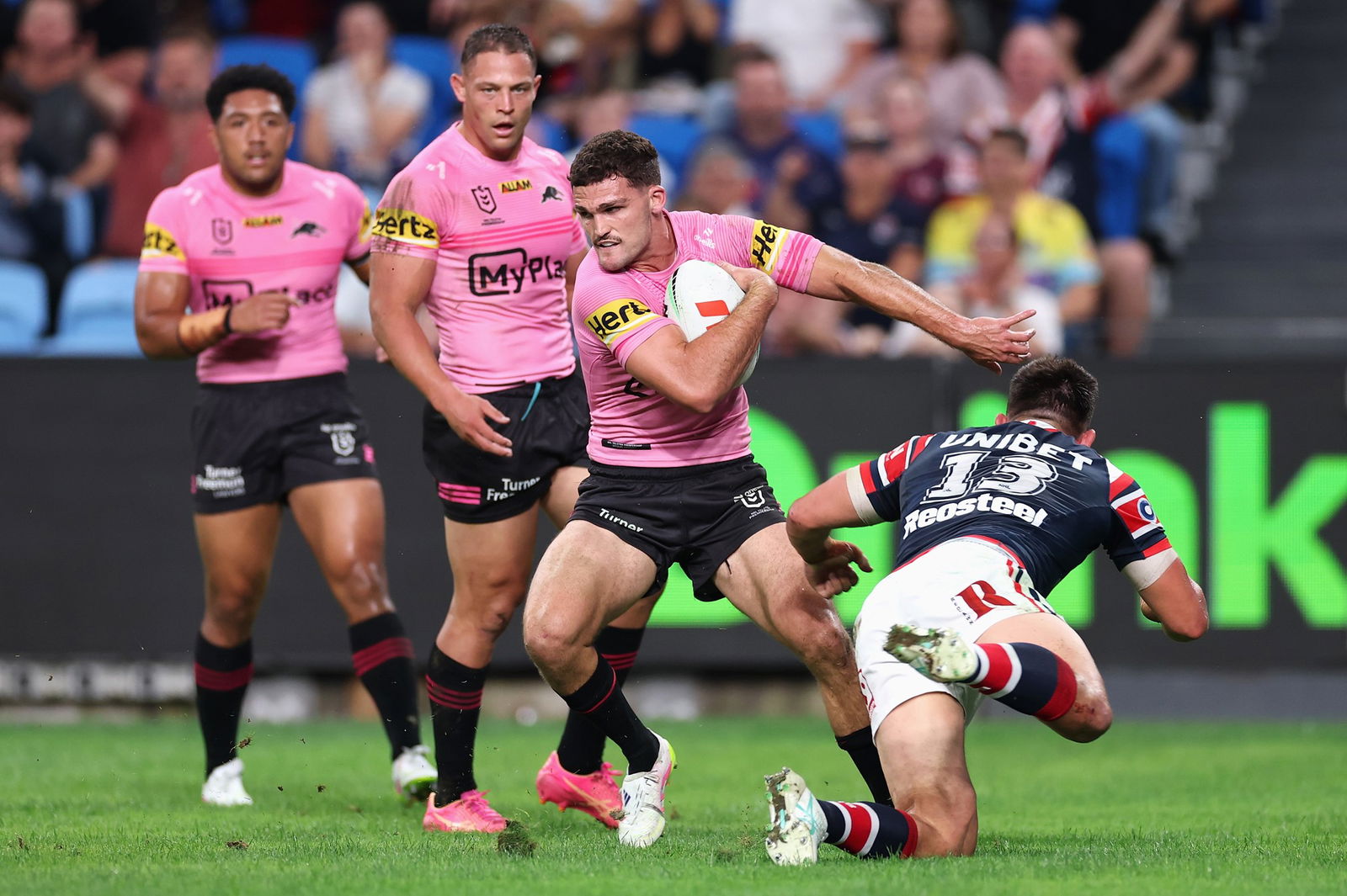 Nathan Cleary throws off the tackle of Victor Radley.