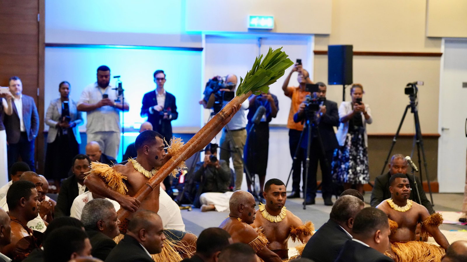 Men particpate in official welcoming ceremony.