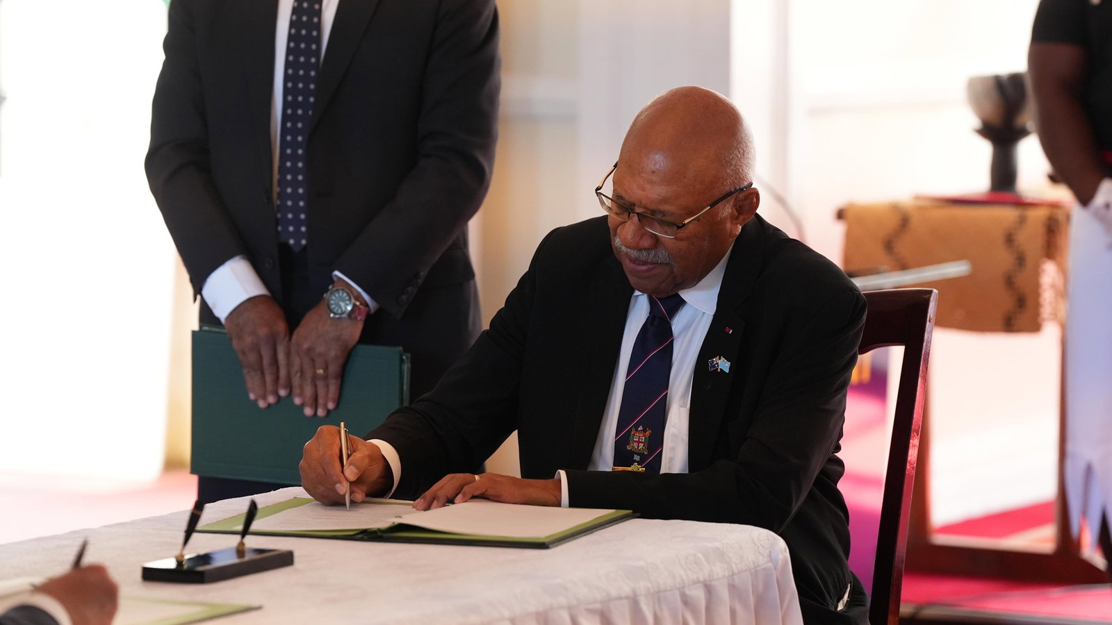 Rabuka signs agreements.