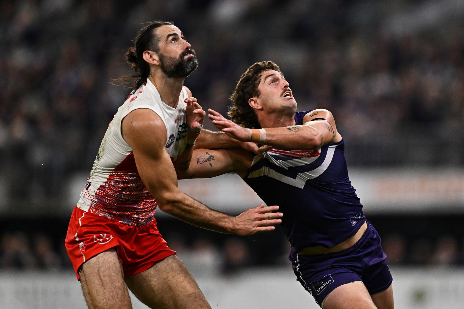 Tonight's clash features a blockbuster ruck match-up between Brodie Grundy (left) and Luke Jackson (right).
