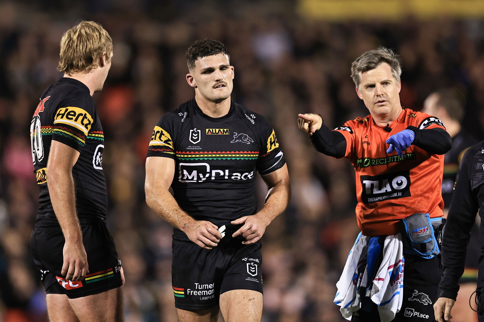 Nathan Cleary. favouring his left shoulder, walks off the field