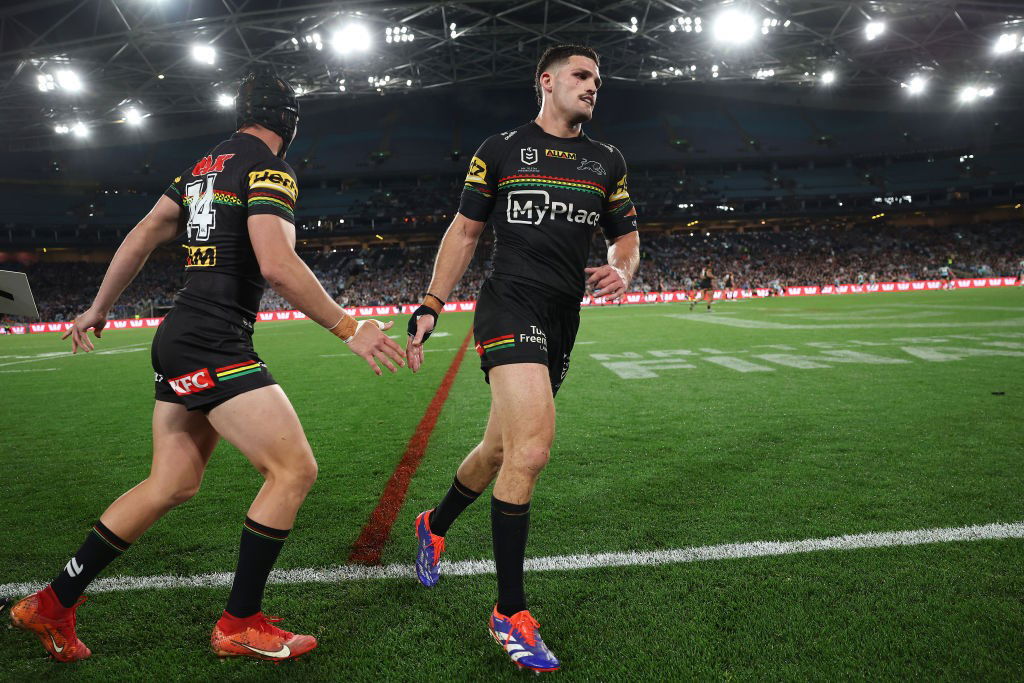 Nathan Cleary runs off the field and Brad Schneider runs on in an NRL game.