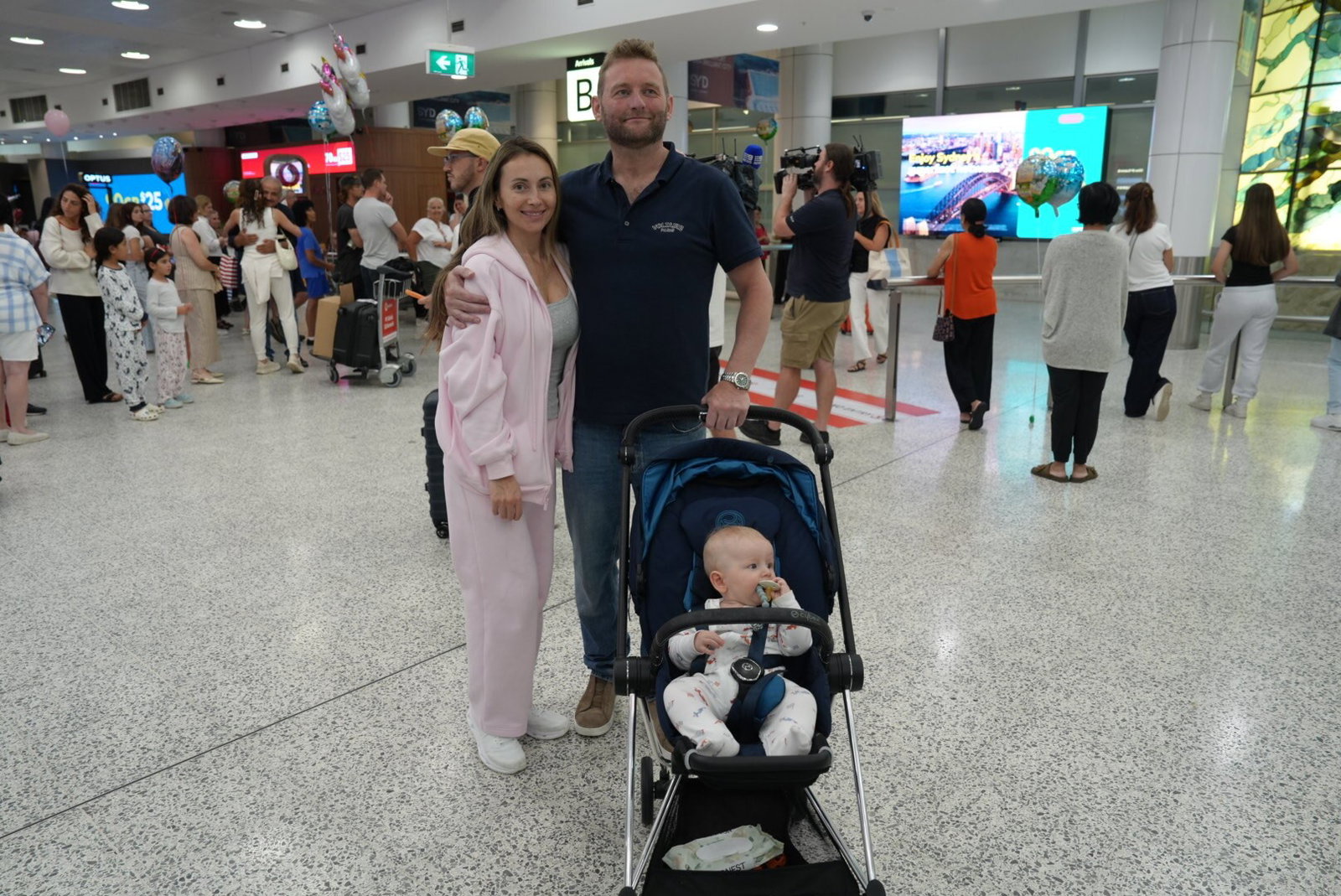 A young couple with a pram