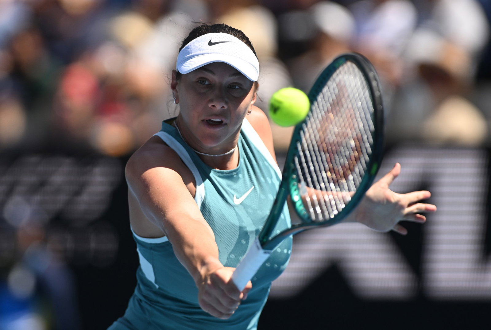 Anisimova hits ball.