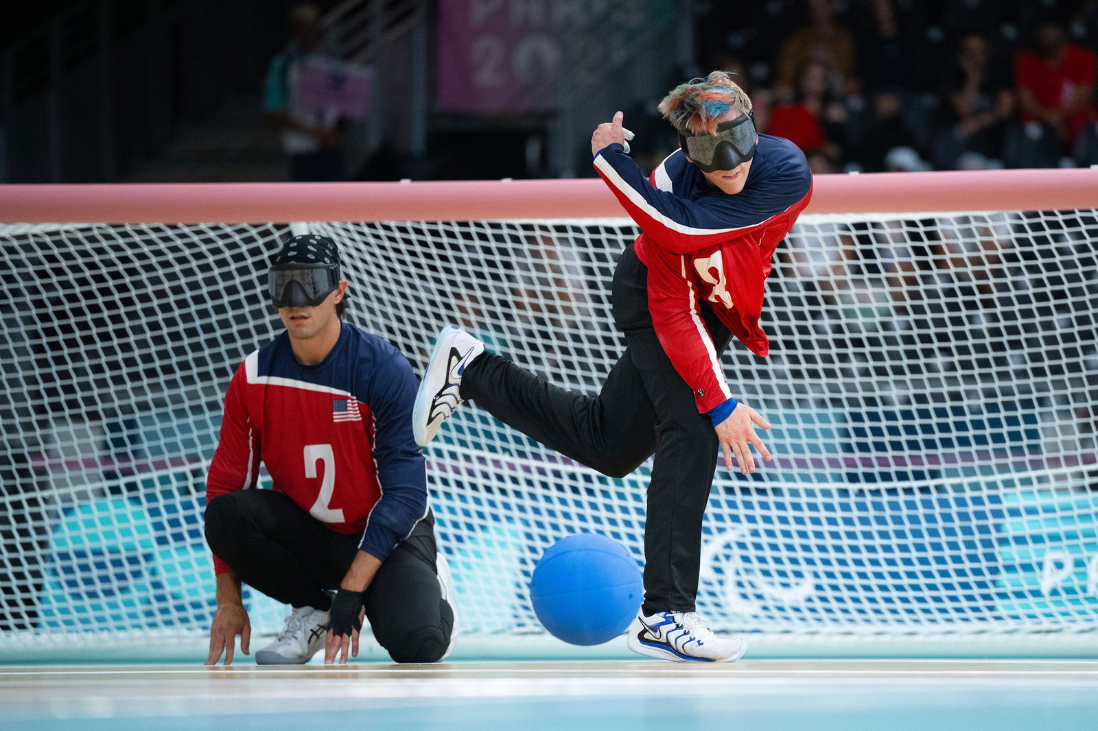 Christian King of the United States takes a shot in a goalball men's quarterfinal against Japan. 