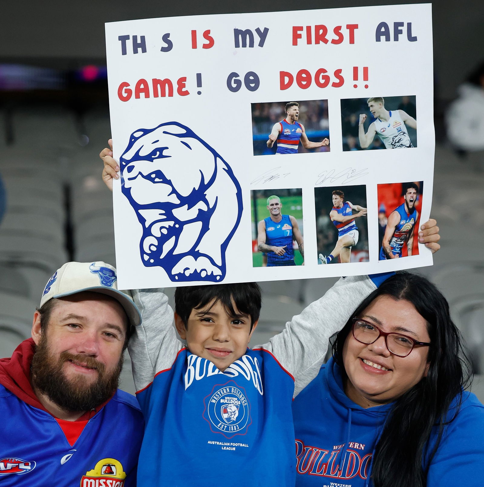 A Bulldogs fan shows a sign from the crowd.