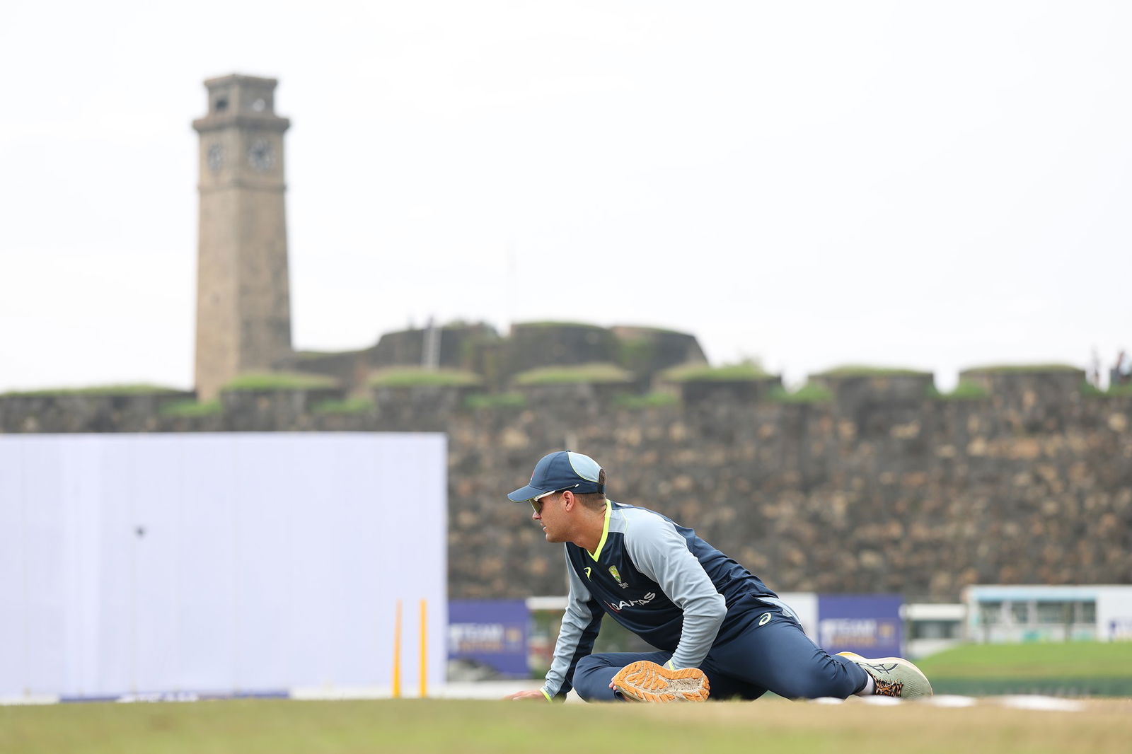 Alex Carey warms up in front of the iconic Galle Fort at the Galle International Cricket Stadium.