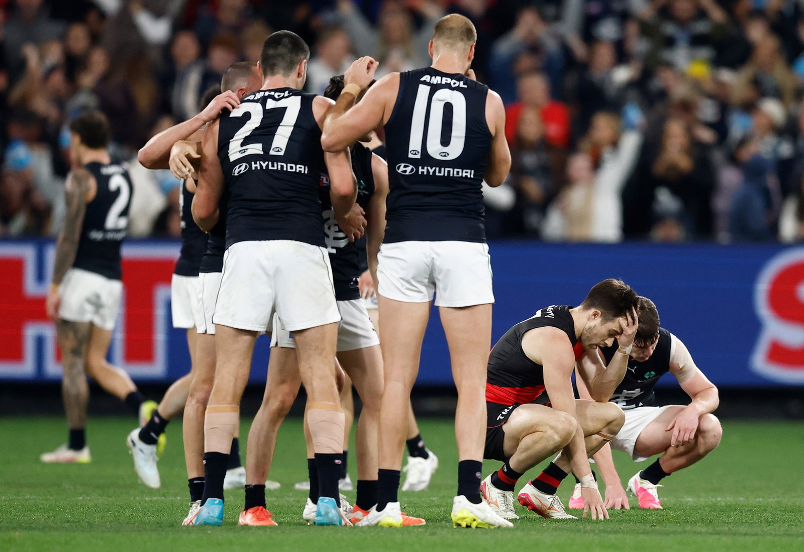 Zach Merrett of the Bombers looks dejected after a loss during the 2026 AFL Round 13 match between the Essendon Bombers and the Carlton Blues at the Melbourne Cricket Ground on June 7, 2026 in Melbourne, Australia.