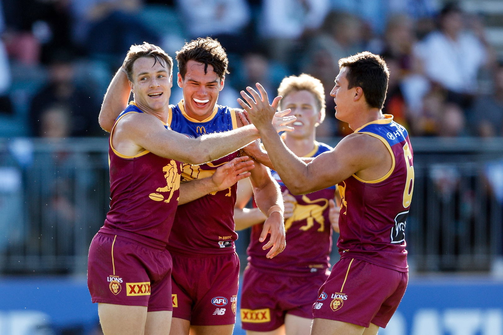 Lions players celebrate a goal