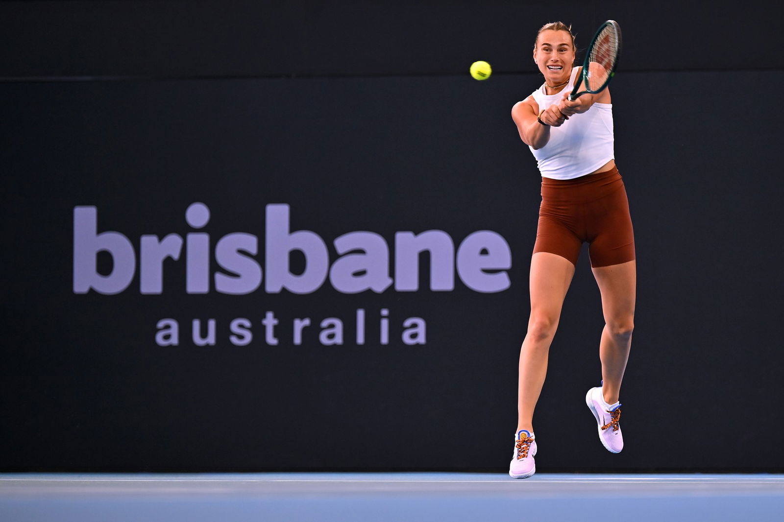 Aryna Sabalenka plays a backhand in warm-up.