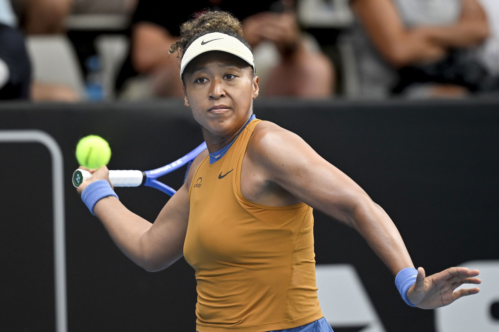 Naomi Osaka plays a forehand.