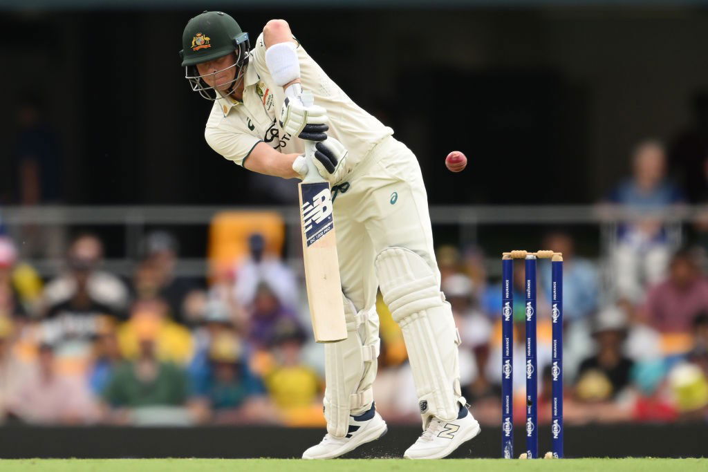 Australian batsman Steve Smith plays an awkward cricket shot.