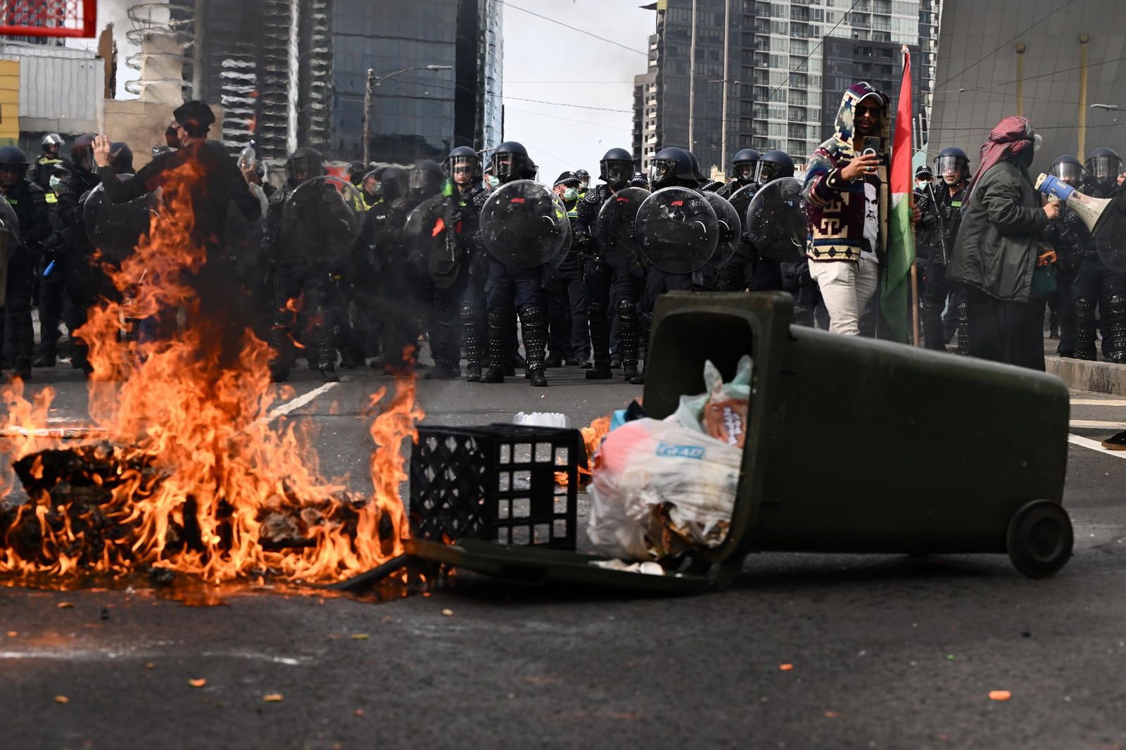 a fire on a bridge at a protest