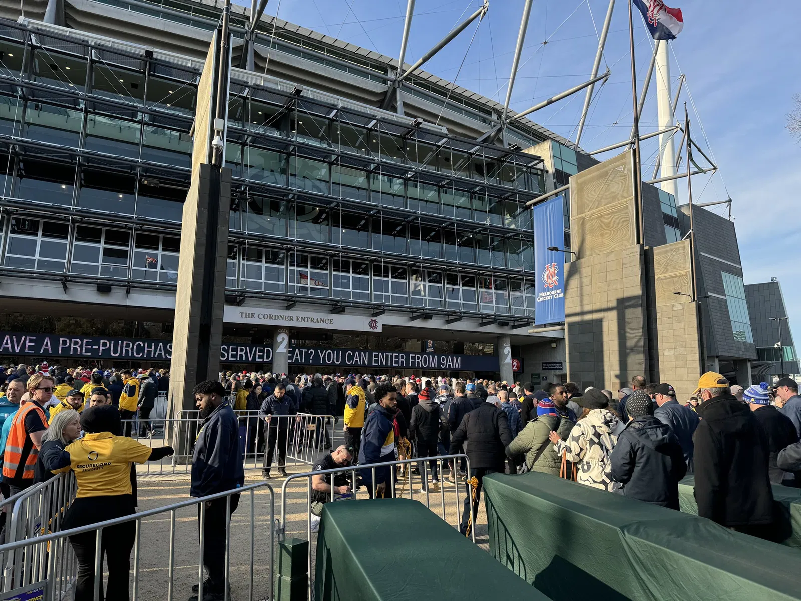 The outside of the MCG, with crowds massing at the gates.