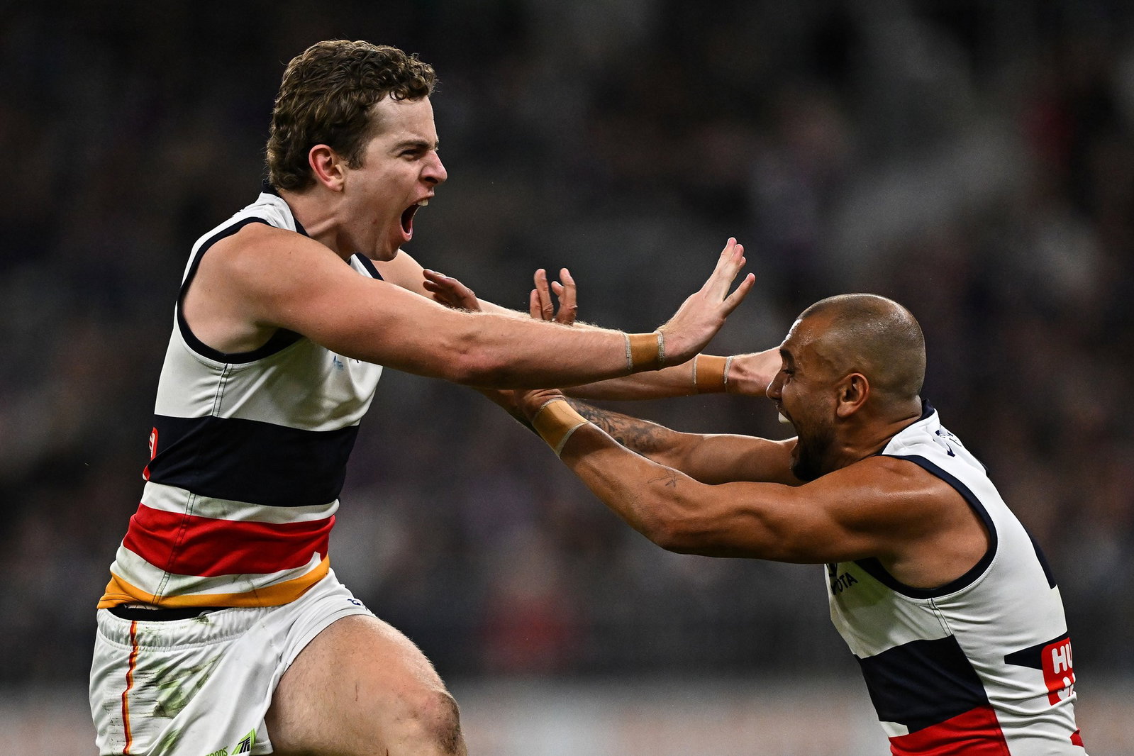 Zac Taylor (left) kicked a crucial goal as the Crows and Dockers turned up the heat in the third quarter.