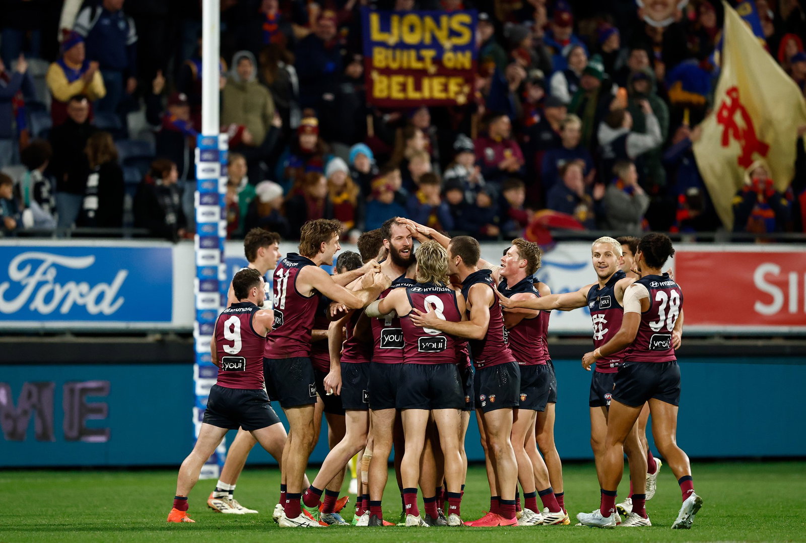 Darcy Fort of the Lions celebrates a goal with teammates during the 2026 AFL Round 17 match between the Geelong Cats and the Brisbane Lions on July 2, 2026 in Geelong, Australia.